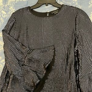 Navy blue - tho it appears black - all sequined top.